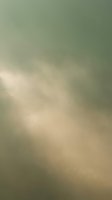 Soft blurred abstract background with warm beige and sage green tones creating dreamy atmospheric effect for modern design projects.