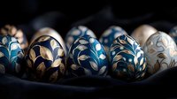 Decorative Easter eggs with elegant gold and blue floral patterns arranged in row on dark background, showcasing traditional holiday craftsmanship and artistic detail.