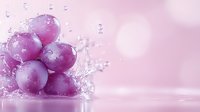Fresh purple grapes with water splash and droplets on pink background, macro photography with bokeh effect for food and beverage advertising.