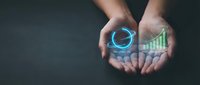 Hands holding glowing digital analytics icons with pie chart and bar graph, representing business data analysis, financial growth, and digital technology solutions.