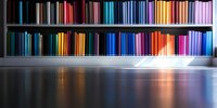 Colorful book spines arranged in rainbow order on library shelves create vibrant reflection on glossy floor surface, modern minimalist educational interior design.