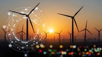 Wind turbines at sunset with digital network overlay representing smart grid technology and renewable energy innovation for sustainable power generation.