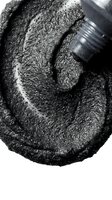 Overhead view of dark glittery powder with brush applicator on white background, isolated for cosmetics, makeup, and beauty design projects.