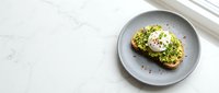 Avocado toast with poached egg on whole grain bread served on gray plate, healthy breakfast or brunch option for food blogs and culinary websites.