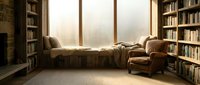 Cozy library reading nook with window seat, built-in bookshelves, armchair and natural light for interior design and home decor projects.