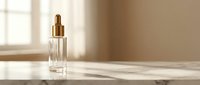 Luxury glass dropper bottle with golden cap on marble surface in soft natural sunlight for premium skincare and beauty products.