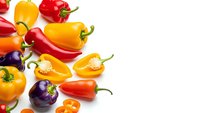 Colorful bell peppers in red, yellow, orange and purple varieties isolated on white background for healthy cooking and nutrition concepts.