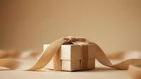 Wrapped gift box with kraft paper and ribbon on neutral beige background, suitable for holiday, birthday, and celebration design projects.