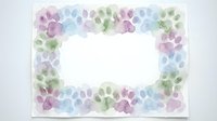Watercolor floral frame with soft pastel flowers in purple, blue and green tones creating elegant border for wedding invitations, greeting cards and stationery.