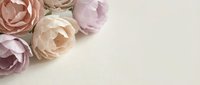 Soft pink and beige roses on neutral textured background with copy space for romantic wedding invitations, greeting cards, and feminine design projects.