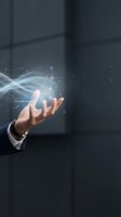 Businessman hand holding glowing digital network connections with light effects and data visualization for technology and innovation concepts.