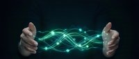 Hands holding glowing green digital energy waves with connected nodes on dark background for technology and innovation concepts.