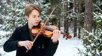 Young Caucasian male musician playing violin outdoors in snowy winter forest, classical music performance in nature setting for artistic projects.