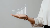 Business growth concept with hand holding virtual increasing graph chart, symbolizing financial success and upward market trends for corporate presentations.