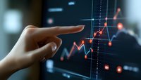 Female hand pointing at growing financial chart on digital screen, glowing red market data visualization with upward trend line shows business growth.