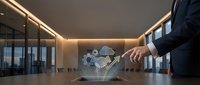 Businessman in dark suit touching holographic cloud computing interface with gears and data icons on conference table in modern office meeting room.