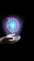 Glowing brain hologram floating above open palm representing artificial intelligence, neuroscience research, mental health awareness and cognitive enhancement.
