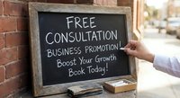 Professional consultant writing free consultation offer on chalkboard sign for business promotion and growth services outside office building.