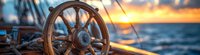 Vintage wooden ship steering wheel against dramatic ocean sunset panorama, with golden light reflecting on polished wood and calm blue waters.