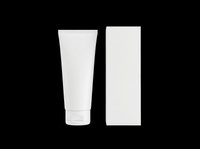 White cosmetic tube and box packaging mockup isolated on transparent background, ready for branding, label design, print on demand, and product presentation.