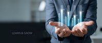 Male professional in business attire holding glowing upward arrows representing growth, success, and progress. Concept for learning, development, career advancement, and business strategy.