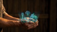 Farmer hands holding glowing digital agriculture icons representing smart farming technology and sustainable food production innovation.