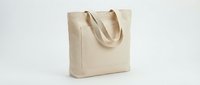 Blank natural canvas tote bag with handles isolated on white background, ready for custom printing, branding, and merchandise design projects.