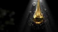 Golden oil drop with bubbles floating in dark space for luxury cosmetic and skincare product advertising campaigns.