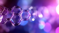 Molecular structure of graphene on purple and blue bokeh background with hexagonal carbon atoms pattern showing nanotechnology concept.