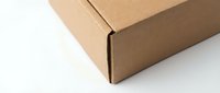Brown cardboard shipping box isolated on white background for packaging and delivery services.