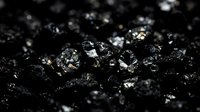 Close-up of raw coal chunks with metallic highlights and reflective surfaces against dark background, suitable for energy, mining, and industrial applications.