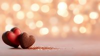 Red and chocolate hearts with romantic bokeh lights background, love concept for Valentine's Day celebration and romantic occasions.