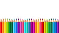 Sharpened colored pencils arranged in a row displaying a vibrant spectrum of hues from red through yellow, green, blue, purple and pink for art, design and creative projects.