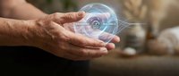 Male hand holding glowing holographic eye symbol representing digital vision, surveillance technology, and future innovation for business and tech concepts.