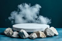 White round podium surrounded by natural gray stones with dramatic smoke effect on dark teal background, modern minimal product display platform.