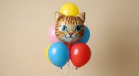 Tabby cat wearing yellow hard hat with blue and red balloons on neutral background, isolated for design use.