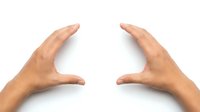 Two hands gesturing as if holding or framing an invisible object, isolated on white background, perfect for size, measurement or product concepts.
