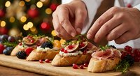 Chef preparing festive holiday appetizers with cranberries and herbs on wooden board. Christmas party food preparation with bokeh lights background.