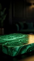 Luxury malachite coffee table with swirling green stone patterns and gold trim in a dark elegant interior setting.