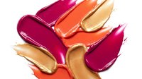 Colorful lipstick smears in pink orange and nude tones isolated on white background for cosmetic beauty and makeup design projects.