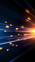 Dynamic light trails with glowing orange particles streaming against dark blue background create futuristic motion effect for technology and speed concepts.