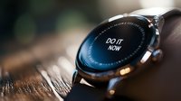 Modern smartwatch displaying motivational message on dark screen against wooden surface with soft bokeh background, close up macro photography.