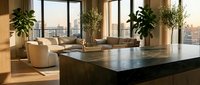 Luxury modern apartment interior with marble kitchen island, designer furniture and city skyline view through floor-to-ceiling windows at sunset.