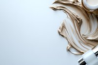 Luxurious beige cosmetic cream texture swirls with silver dispenser on white background, elegant skincare product photography for beauty industry and advertising.