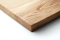 Close-up view of natural pine wood plank corner showing detailed grain texture and raw edge against white background, suitable for construction projects.