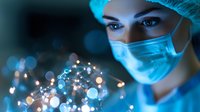 Female medical professional in protective mask and cap examining glowing particles with dramatic blue lighting and bokeh effect in laboratory setting.