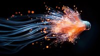 Glowing fiber optic cables emit orange light and sparkles against dark background, modern technology concept for digital communication and data transfer networks.