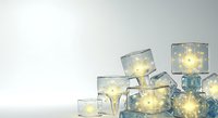 Glowing light bulbs encased in transparent ice cubes stacked together, creating a luminous winter display for holiday and seasonal design projects.