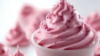Pink soft serve ice cream with colorful sprinkles in white cup, creamy swirl dessert treat for summer menu, bakery advertising and food photography.