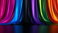 Vibrant multicolored silk fabric drapes with dramatic folds against black background creating rainbow effect with reflective surface below. Luxury textile concept.